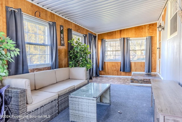 unfurnished sunroom with vaulted ceiling