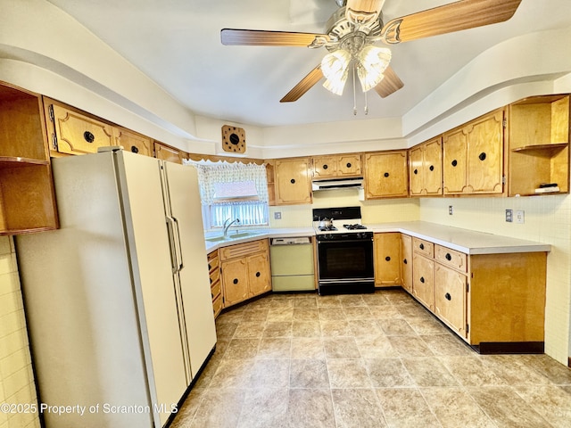 2052 Farr St 2050, Scranton, PA 18504 - kitchen featuring dishwashing machine, freestanding refrigerator, gas stove, under cabinet range hood, and a sink