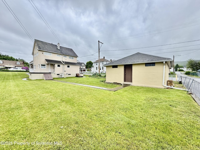 2052 Farr St 2050, Scranton, PA 18504 - rear view of house with roof with shingles and stucco siding