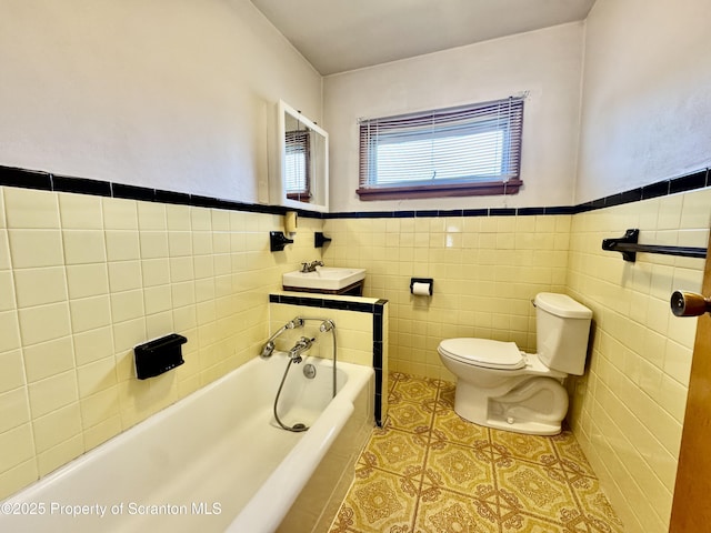 2052 Farr St 2050, Scranton, PA 18504 - bathroom featuring toilet, a sink, tile patterned floors, a garden tub, and wainscoting