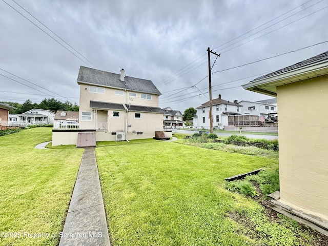 2052 Farr St 2050, Scranton, PA 18504 - rear view of house with a yard, a residential view, and stucco siding