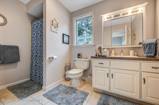 bathroom featuring tile patterned floors, vanity, curtained shower, and toilet