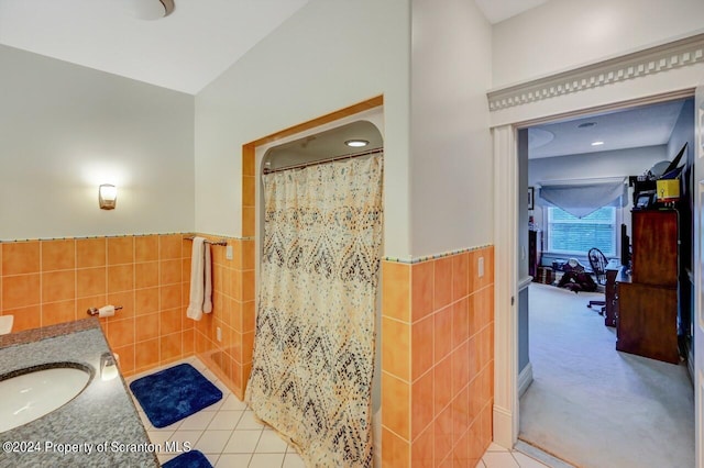 bathroom with tile patterned floors, vanity, tile walls, and a shower with shower curtain