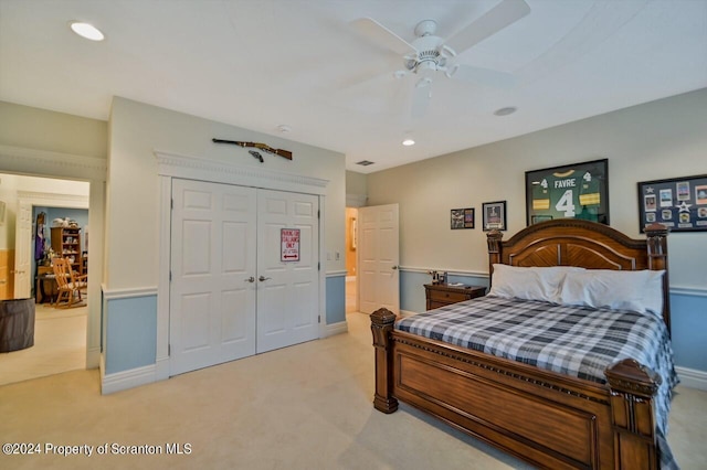 bedroom with light carpet, a closet, and ceiling fan