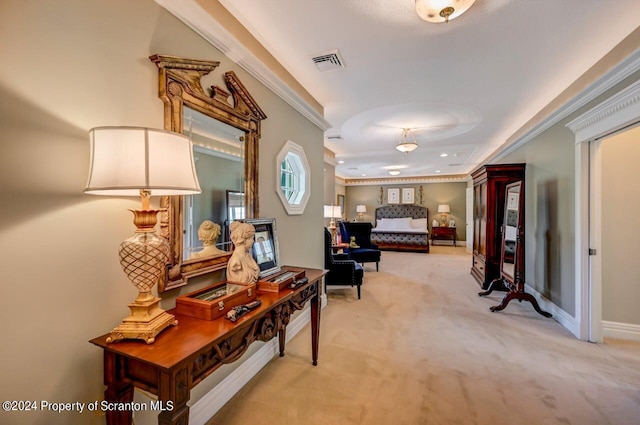 hallway with light carpet and crown molding