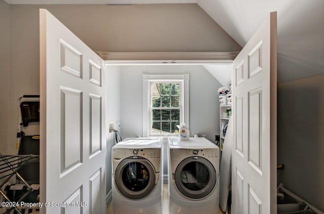 washroom featuring washing machine and dryer