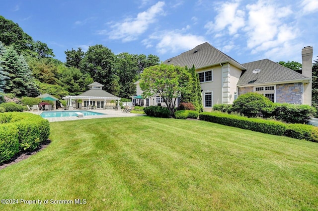 view of yard featuring a gazebo and a patio