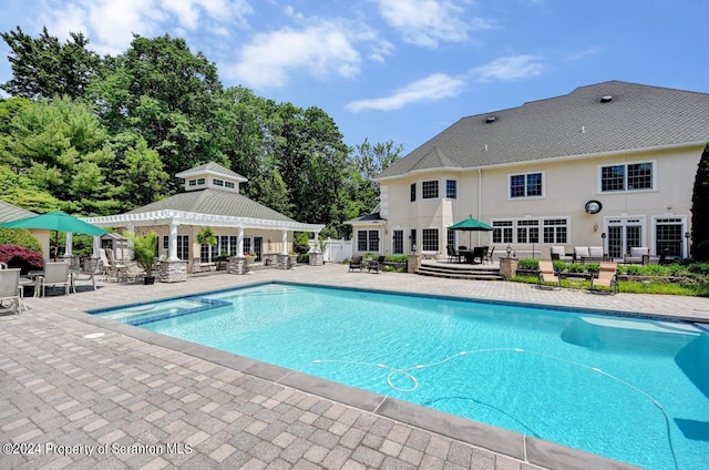 view of pool featuring a gazebo and a patio area