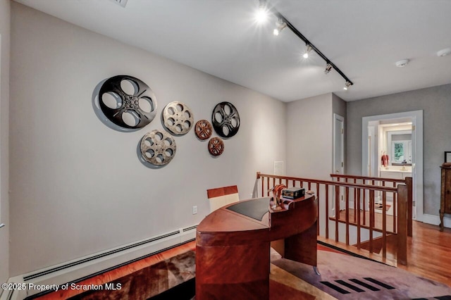 119 Glenmaura Dr, Moosic, PA 18507 - dining area with a baseboard radiator, wood finished floors, and track lighting