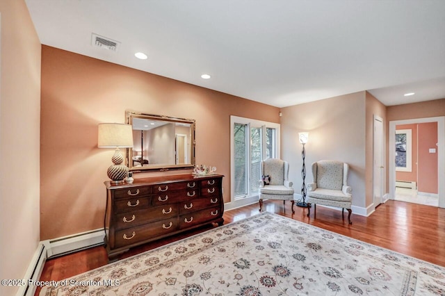 119 Glenmaura Dr, Moosic, PA 18507 - sitting room with wood finished floors, a baseboard radiator, a baseboard heating unit, and recessed lighting