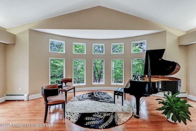 119 Glenmaura Dr, Moosic, PA 18507 - sitting room featuring baseboard heating, wood finished floors, a baseboard heating unit, and high vaulted ceiling