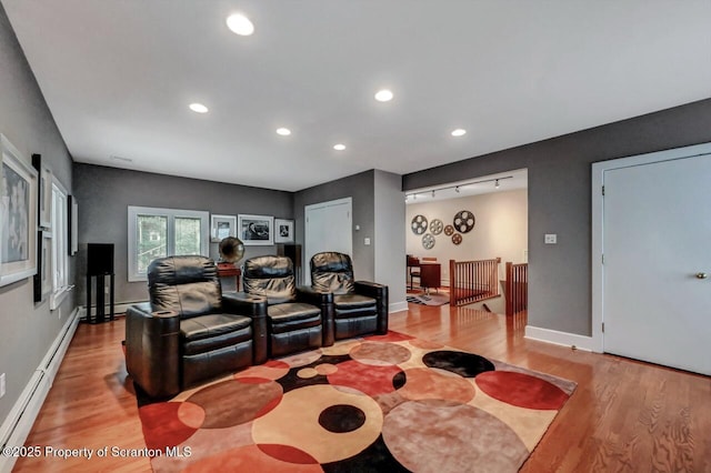 119 Glenmaura Dr, Moosic, PA 18507 - home theater featuring light wood-style floors, recessed lighting, and a baseboard heating unit