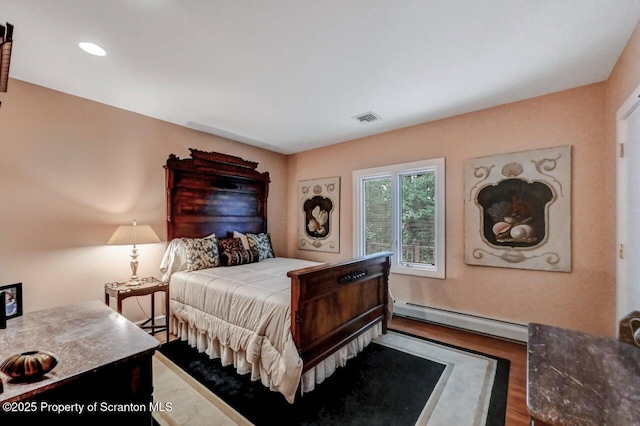 119 Glenmaura Dr, Moosic, PA 18507 - bedroom with a baseboard radiator, wood finished floors, and recessed lighting