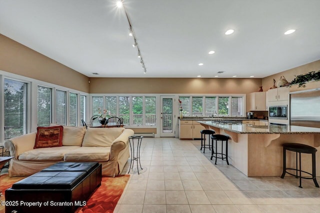 119 Glenmaura Dr, Moosic, PA 18507 - living room with light tile patterned floors, track lighting, and recessed lighting