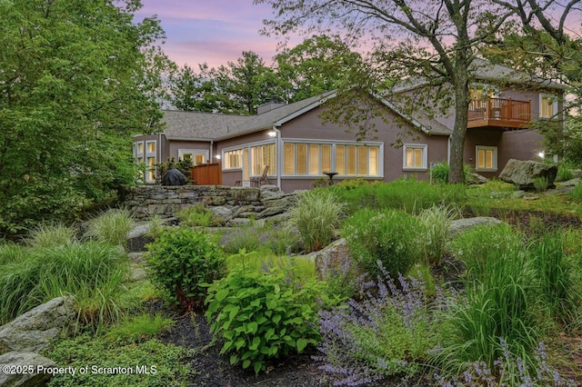 119 Glenmaura Dr, Moosic, PA 18507 - back of property at dusk featuring stucco siding