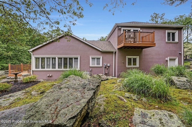 119 Glenmaura Dr, Moosic, PA 18507 - rear view of property with stucco siding and a balcony