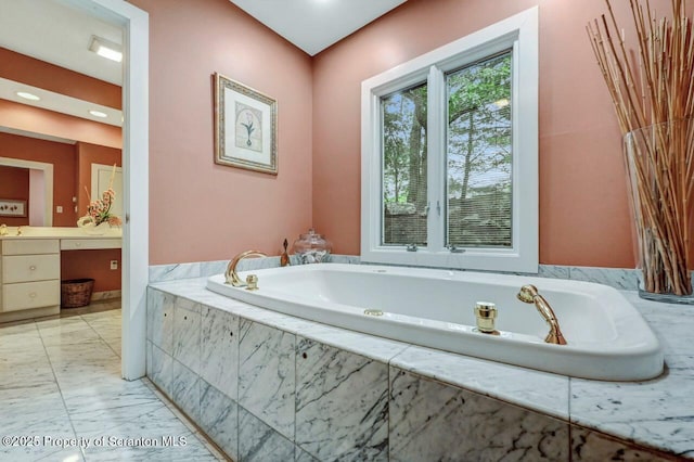 119 Glenmaura Dr, Moosic, PA 18507 - bathroom featuring vanity, a garden tub, and marble finish floors