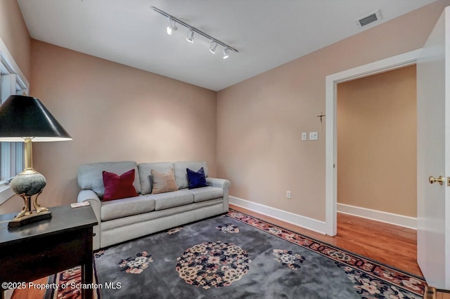 119 Glenmaura Dr, Moosic, PA 18507 - living room featuring rail lighting and wood finished floors