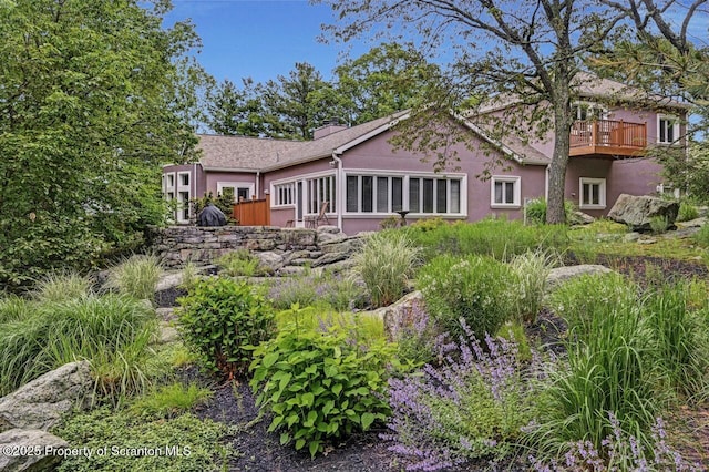 119 Glenmaura Dr, Moosic, PA 18507 - rear view of property with stucco siding and a chimney