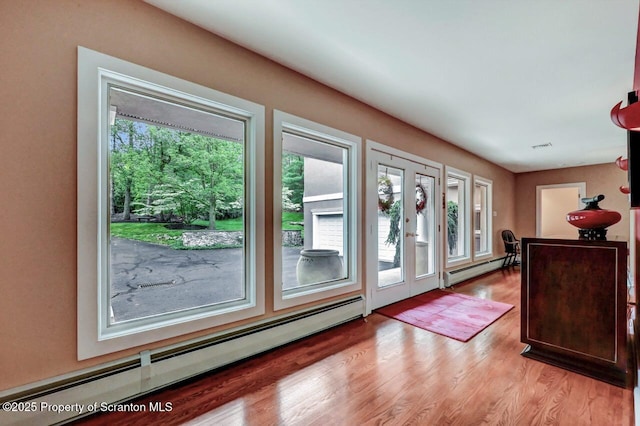 119 Glenmaura Dr, Moosic, PA 18507 - entrance foyer with a baseboard radiator and light wood-style flooring