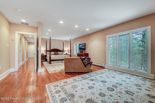 119 Glenmaura Dr, Moosic, PA 18507 - bedroom featuring a baseboard heating unit, light wood-type flooring, and recessed lighting