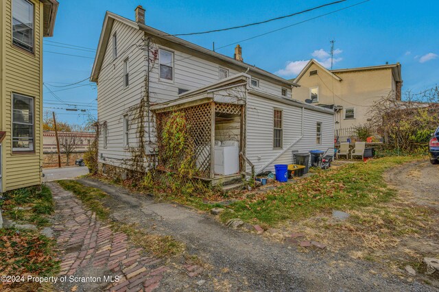 back of house featuring washer and dryer