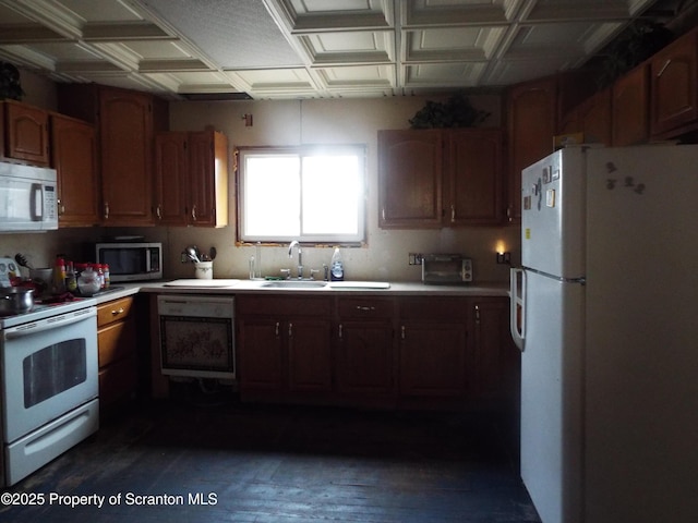 410 21st Ave, Scranton, PA 18504 - kitchen featuring white appliances, light countertops, and dark wood-style flooring