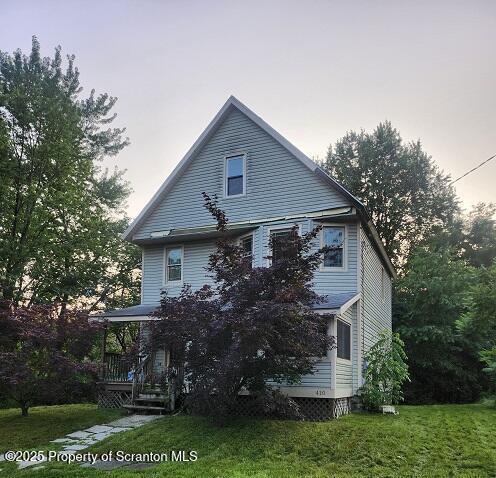410 21st Ave, Scranton, PA 18504 - rear view of house with a lawn and covered porch