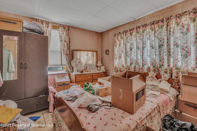 bedroom featuring a drop ceiling