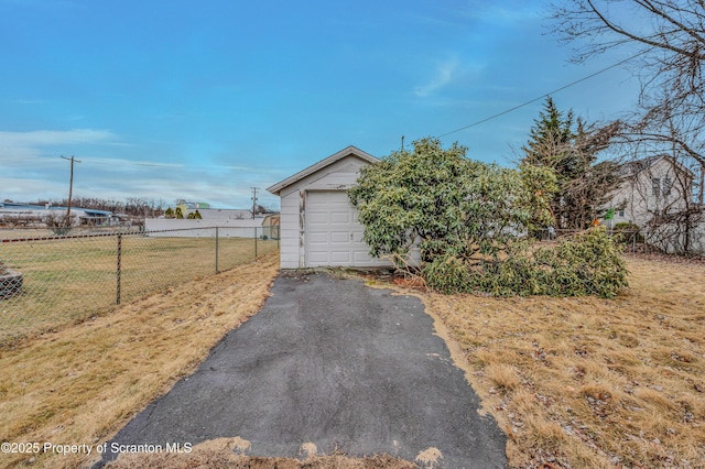 exterior space featuring fence and driveway