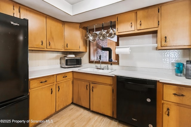 2807 S Webster Ave, Scranton, PA 18505 - kitchen featuring black appliances, light countertops, tasteful backsplash, and light wood-style flooring