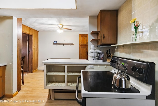 2807 S Webster Ave, Scranton, PA 18505 - kitchen featuring stove, open shelves, light countertops, and light wood-style flooring