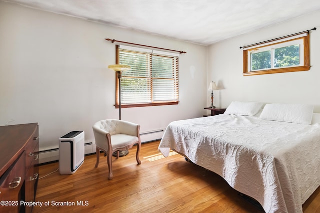 2807 S Webster Ave, Scranton, PA 18505 - bedroom with wood finished floors and baseboard heating
