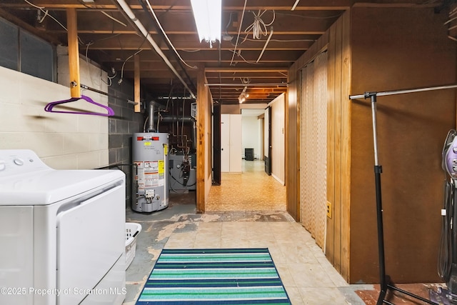 2807 S Webster Ave, Scranton, PA 18505 - unfinished below grade area with gas water heater, washer / dryer, concrete block wall, and a heating unit