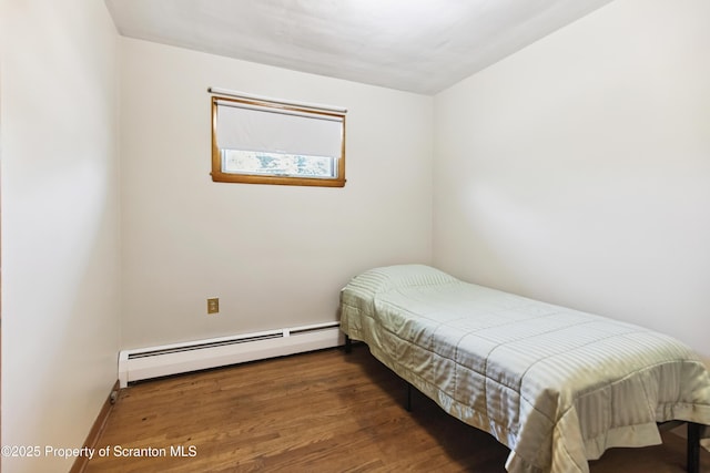 2807 S Webster Ave, Scranton, PA 18505 - bedroom with a baseboard heating unit and wood finished floors