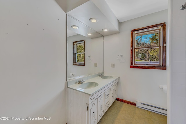 bathroom featuring vanity and a baseboard heating unit