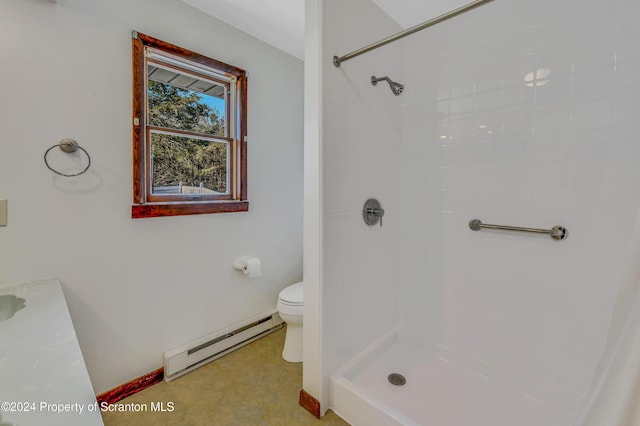 bathroom featuring walk in shower, toilet, and a baseboard heating unit