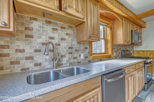 326 Neptune Pl, Scranton, PA 18505 - kitchen with appliances with stainless steel finishes, backsplash, wood finished floors, a wainscoted wall, and light stone countertops