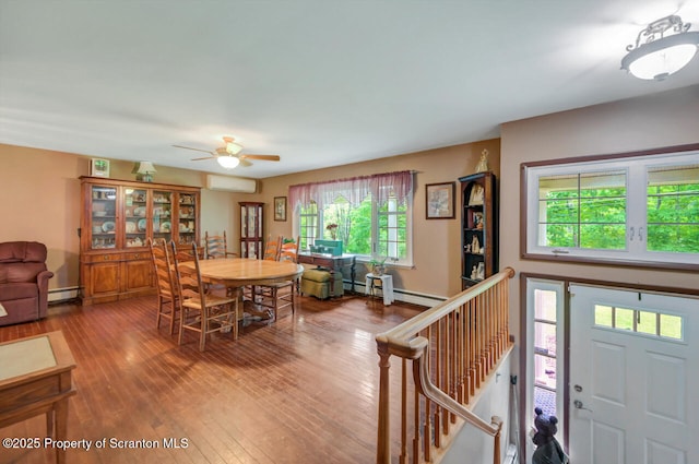 592 Gravel Pond Rd, Clarks Summit, PA 18411 - dining room with a wall mounted AC, hardwood / wood-style floors, a ceiling fan, and baseboard heating