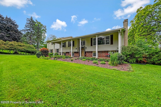 592 Gravel Pond Rd, Clarks Summit, PA 18411 - bi-level home featuring a front lawn and a chimney