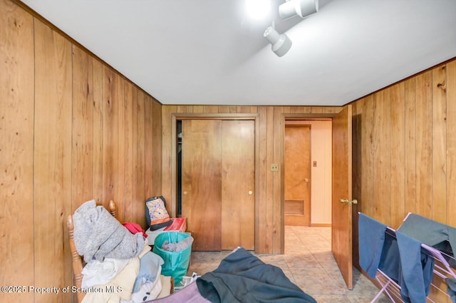 592 Gravel Pond Rd, Clarks Summit, PA 18411 - tiled bedroom with wood walls and a closet