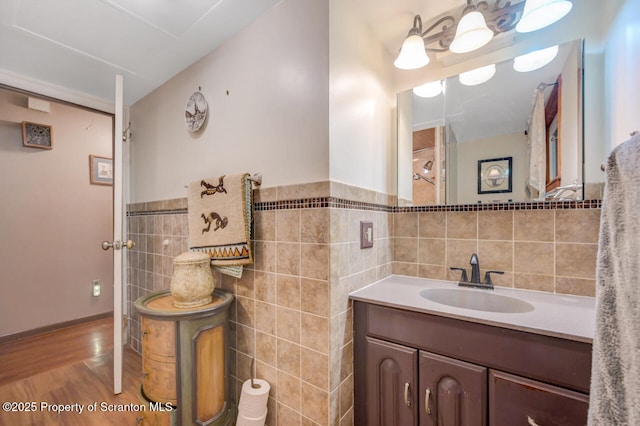 592 Gravel Pond Rd, Clarks Summit, PA 18411 - bathroom with tile walls, vanity, wood finished floors, and wainscoting