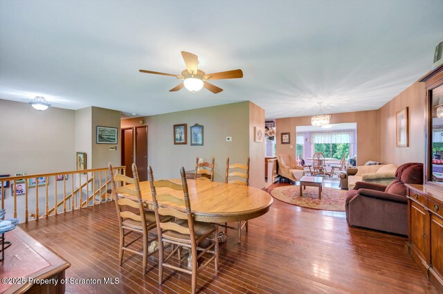 592 Gravel Pond Rd, Clarks Summit, PA 18411 - dining space with wood finished floors, ceiling fan, and a chandelier