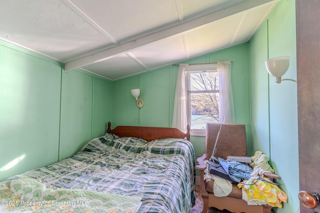 272 Lake Blvd, Clifford Twp, PA 18470 - bedroom with lofted ceiling with beams and a decorative wall