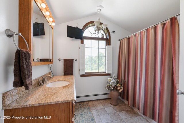 73 Quinton Rd, Scott Twp, PA 18447 - full bath with a baseboard heating unit, lofted ceiling, vanity, and a chandelier