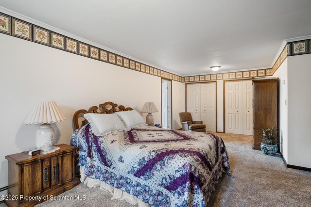 73 Quinton Rd, Scott Twp, PA 18447 - carpeted bedroom with two closets, crown molding, and baseboard heating