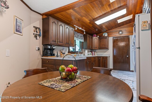 73 Quinton Rd, Scott Twp, PA 18447 - kitchen with freestanding refrigerator, vaulted ceiling, a skylight, wooden ceiling, and light countertops