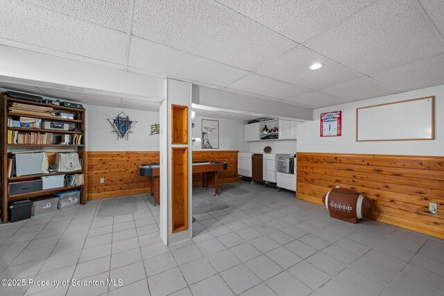 73 Quinton Rd, Scott Twp, PA 18447 - finished below grade area with a paneled ceiling, wood walls, a wainscoted wall, light tile patterned floors, and recessed lighting