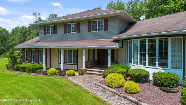 73 Quinton Rd, Scott Twp, PA 18447 - view of front facade featuring a front lawn, a porch, and roof with shingles