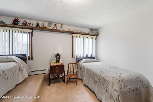 73 Quinton Rd, Scott Twp, PA 18447 - bedroom featuring baseboard heating, multiple windows, light carpet, and a textured ceiling